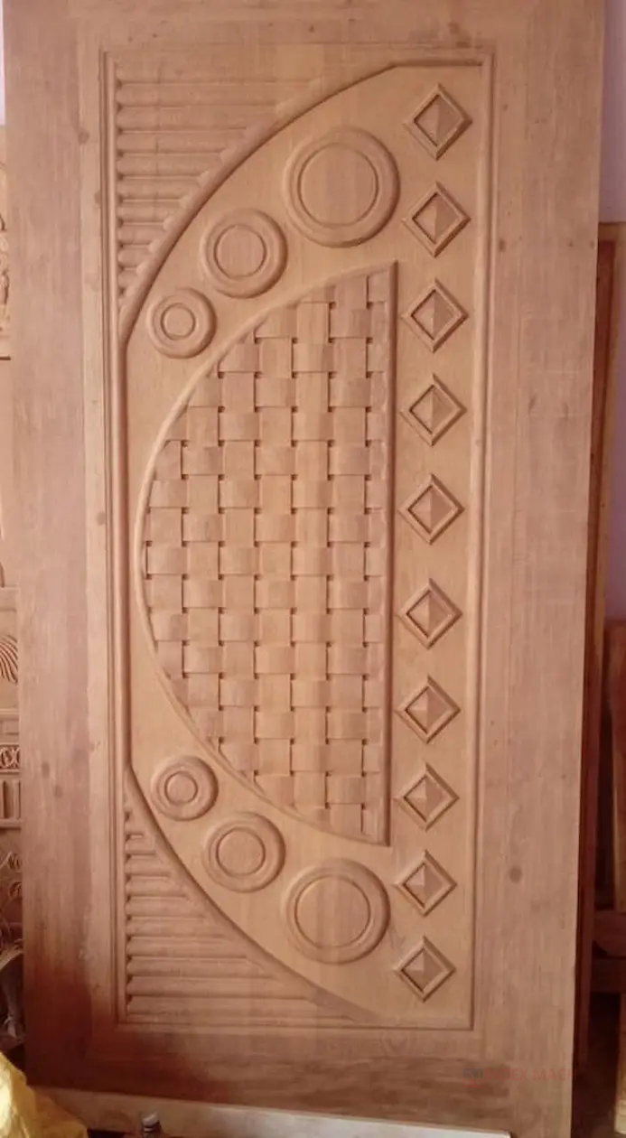 Routed wood door panel — typical repeating door component work for a multi-head CNC